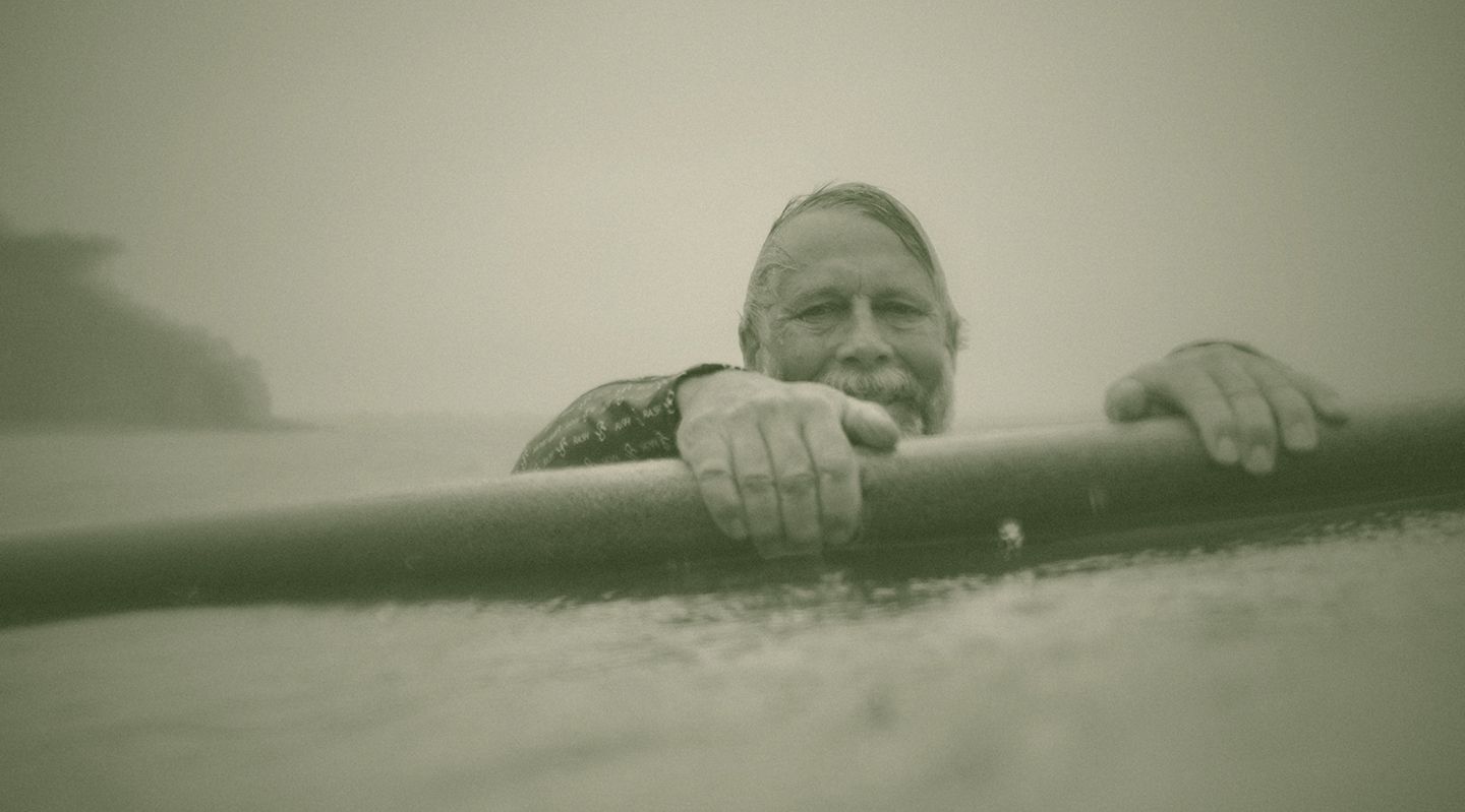 Tom Wegener with a surfboard