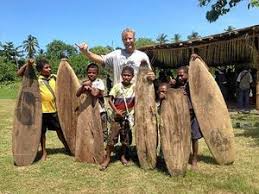 Tom with local board builders, Tupira Surf Camp, Papua New Guinea.
